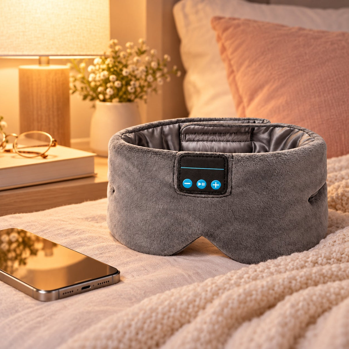 Lullune sleep mask next to a phone